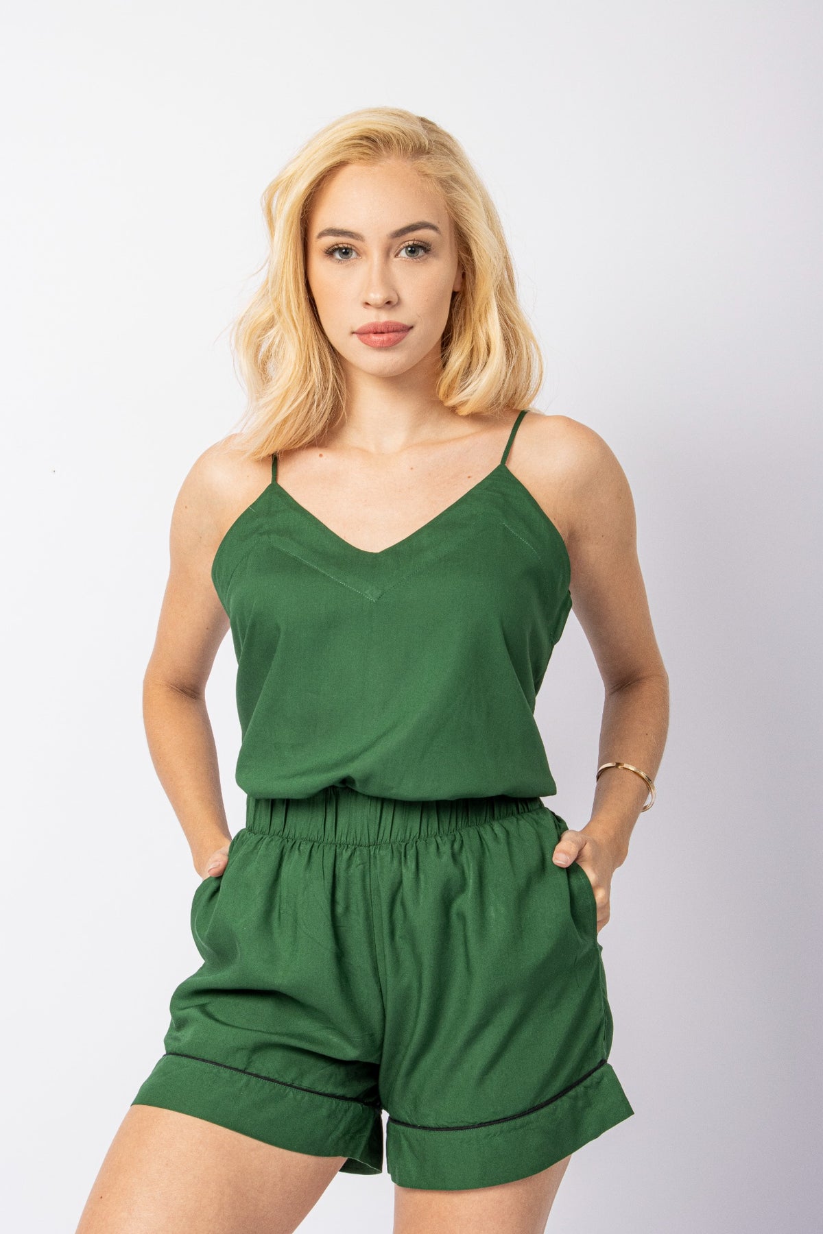 Model wearing the green Signature Set with Lottie cami and Maude shorts